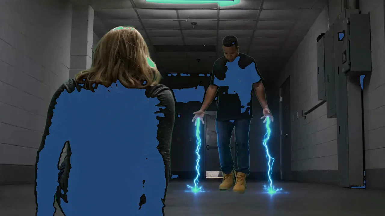 A frame with the highlight mask over the bright ceiling lights and the shadow mask over the dark figures and corridor, while the midtones stay untouched.